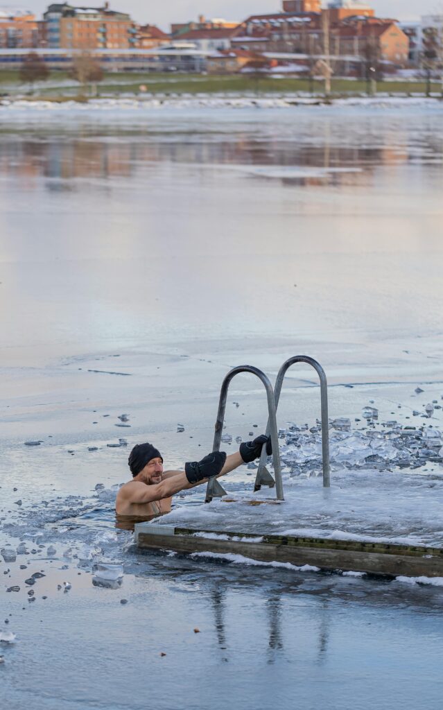 Man stepping into cold shower — start your day with something hard